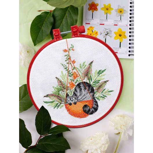 Cross-stitch kits And in the basket is a cat